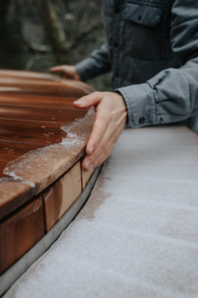 Cedar barrel hot tub in winter