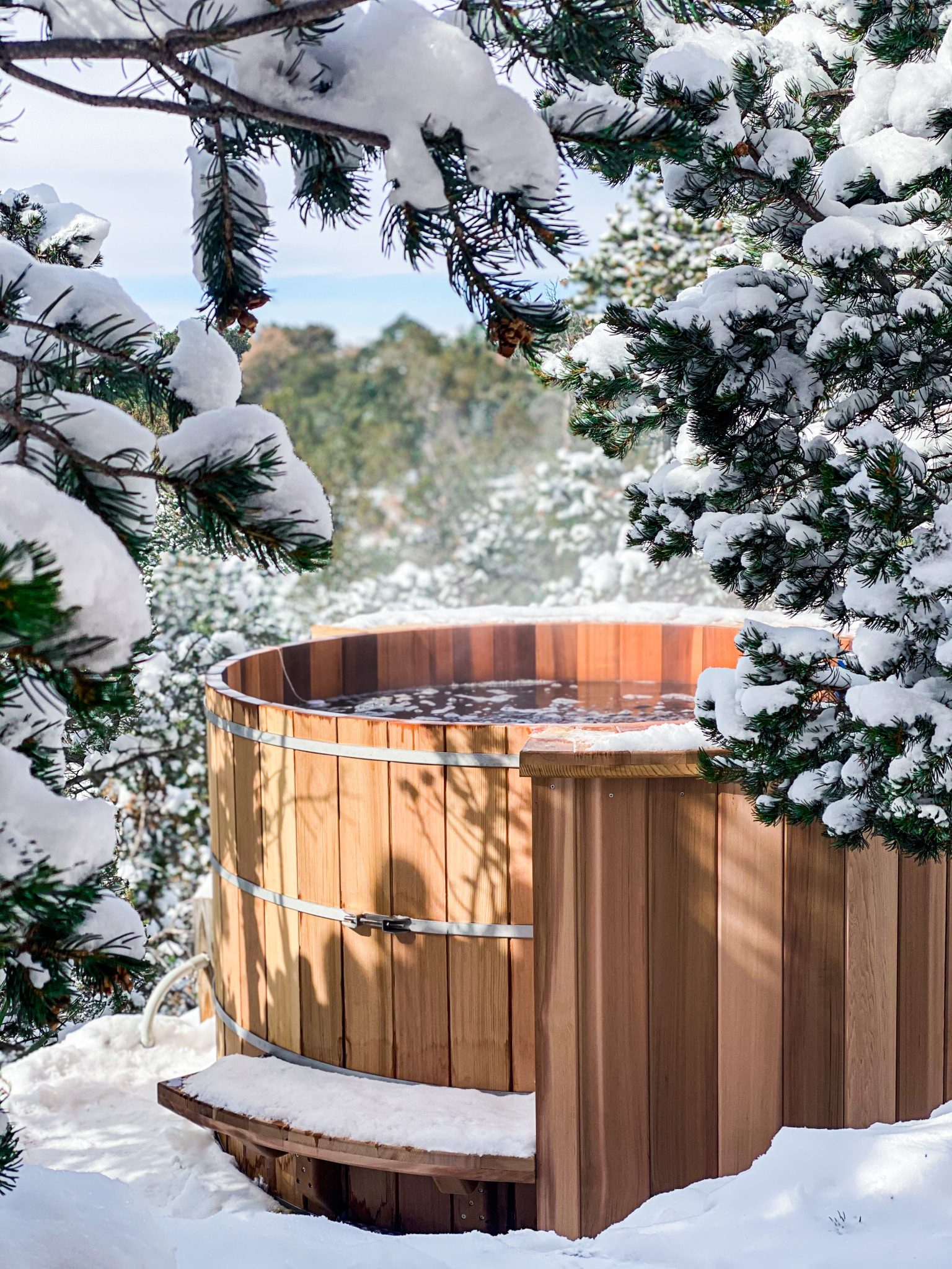cedar hot tub in the snow